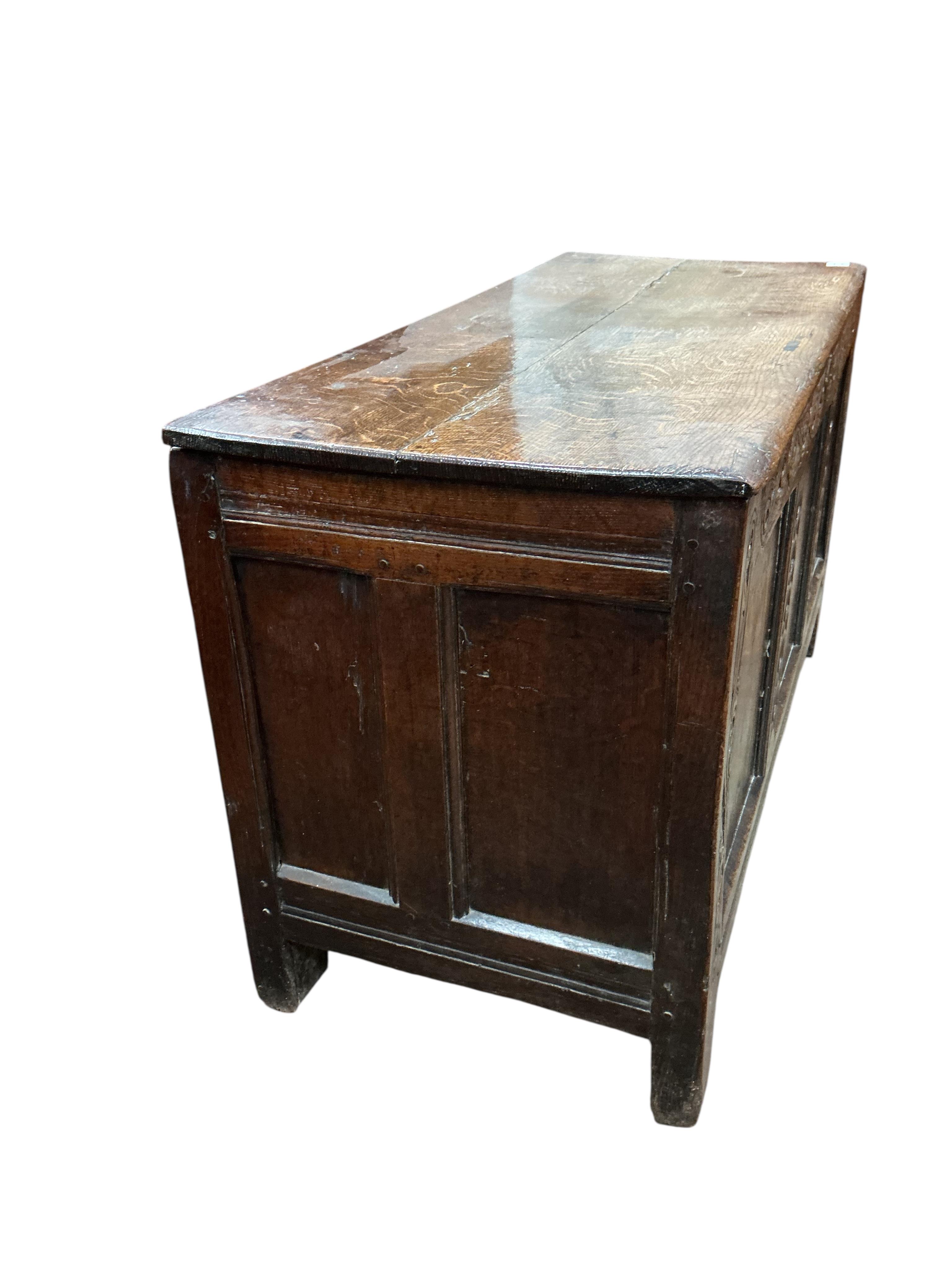An 18th century panelled oak coffer, width 111cm, depth 48cm, height 65cm